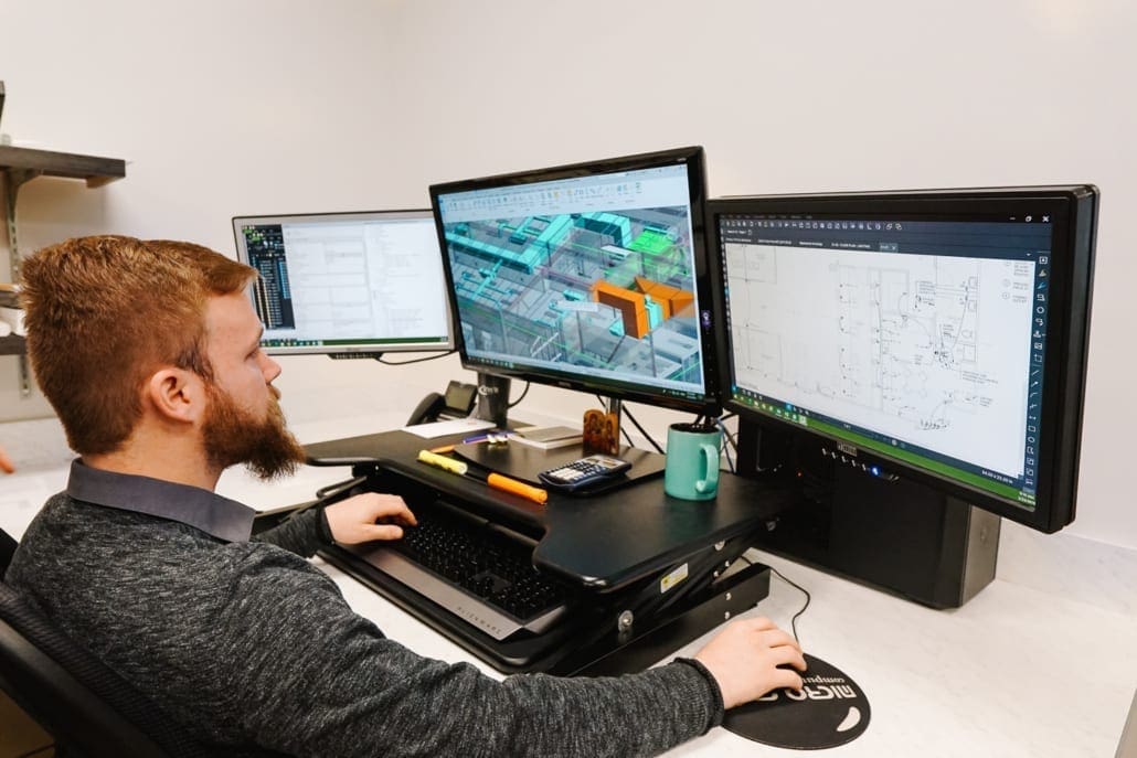 RWB employee at computer working on a building information model (BIM)