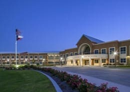 An image at dusk of Midlothian Heritage High School